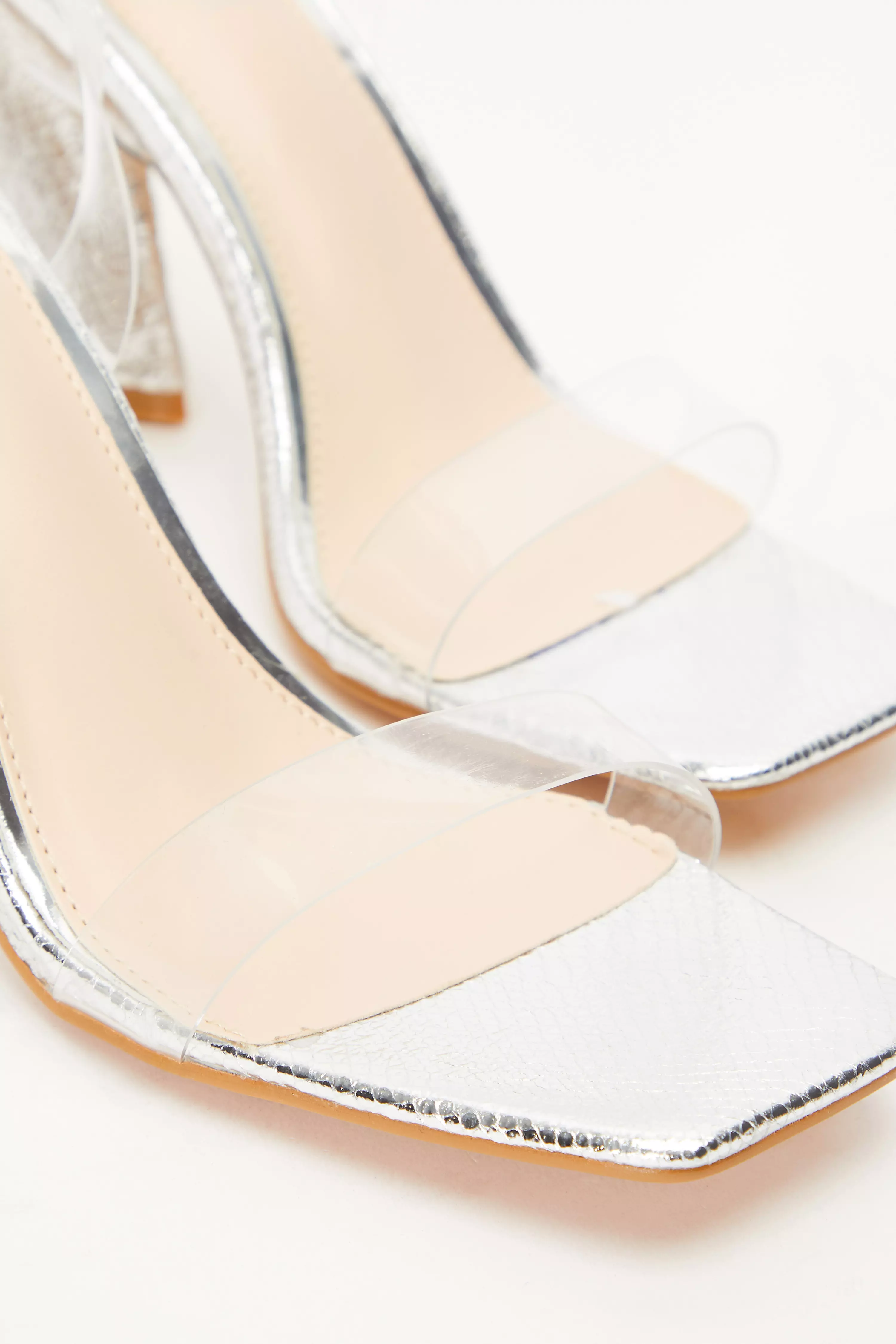 Clear sales triangle heels