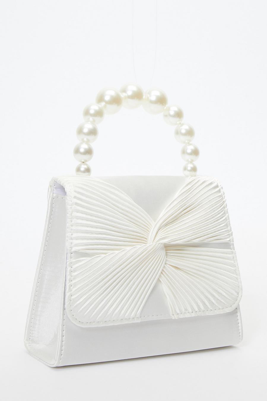 Bag with clearance pearl handle